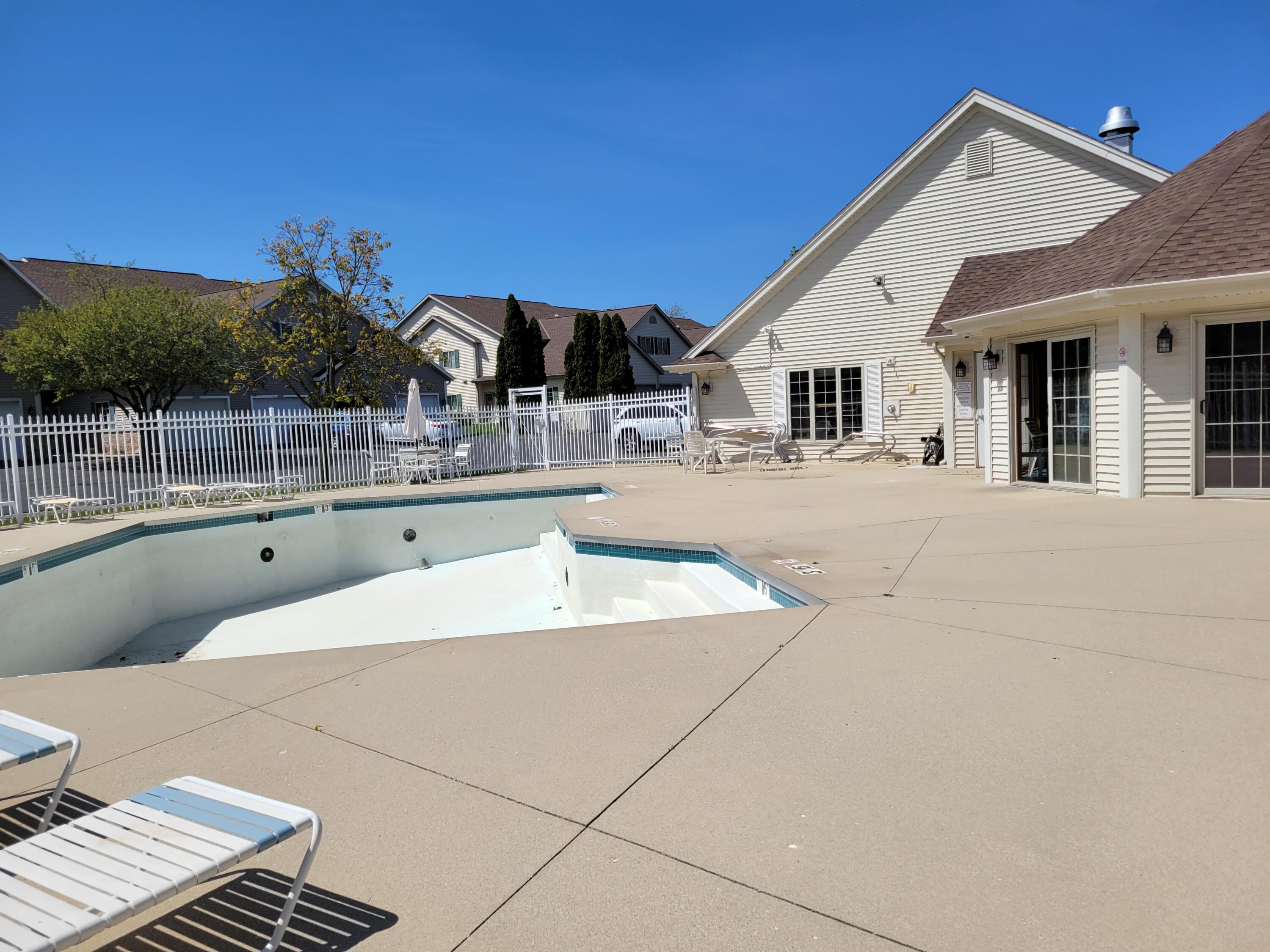 2111 Pine Ridge Court, Unit E Grafton, WI 53024 - Photo 35 of 35 Pool to clubhouse view