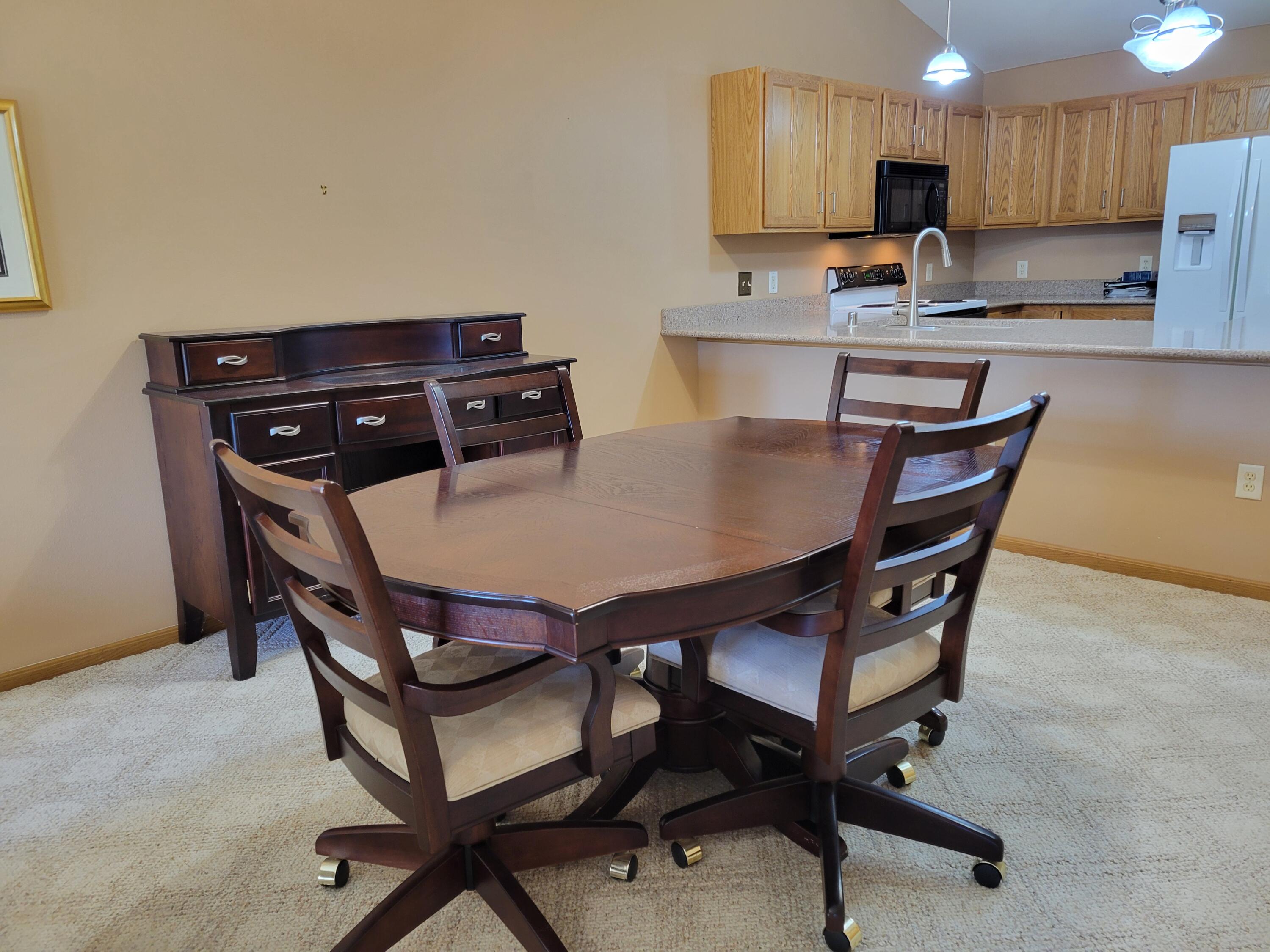 2111 Pine Ridge Court, Unit E Grafton, WI 53024 - Photo 8 of 35 Dining view to kitchen