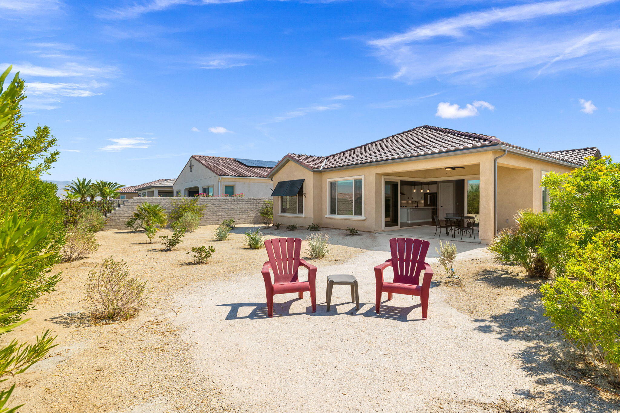 60 Prosecco Rancho Mirage, CA 92270 - Photo 12 of 48 a patio with table and chairs and potted plants