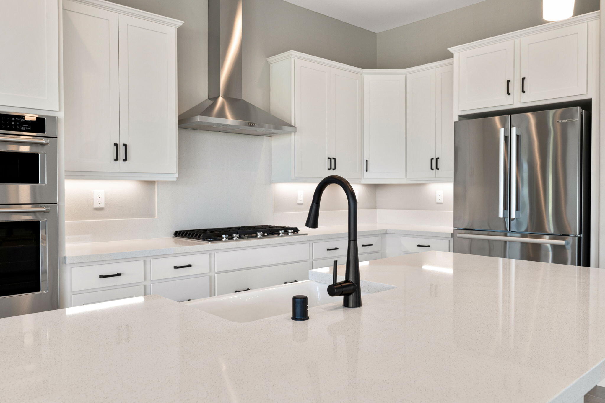 60 Prosecco Rancho Mirage, CA 92270 - Photo 16 of 48 a kitchen with granite countertop a white stove top oven and cabinets