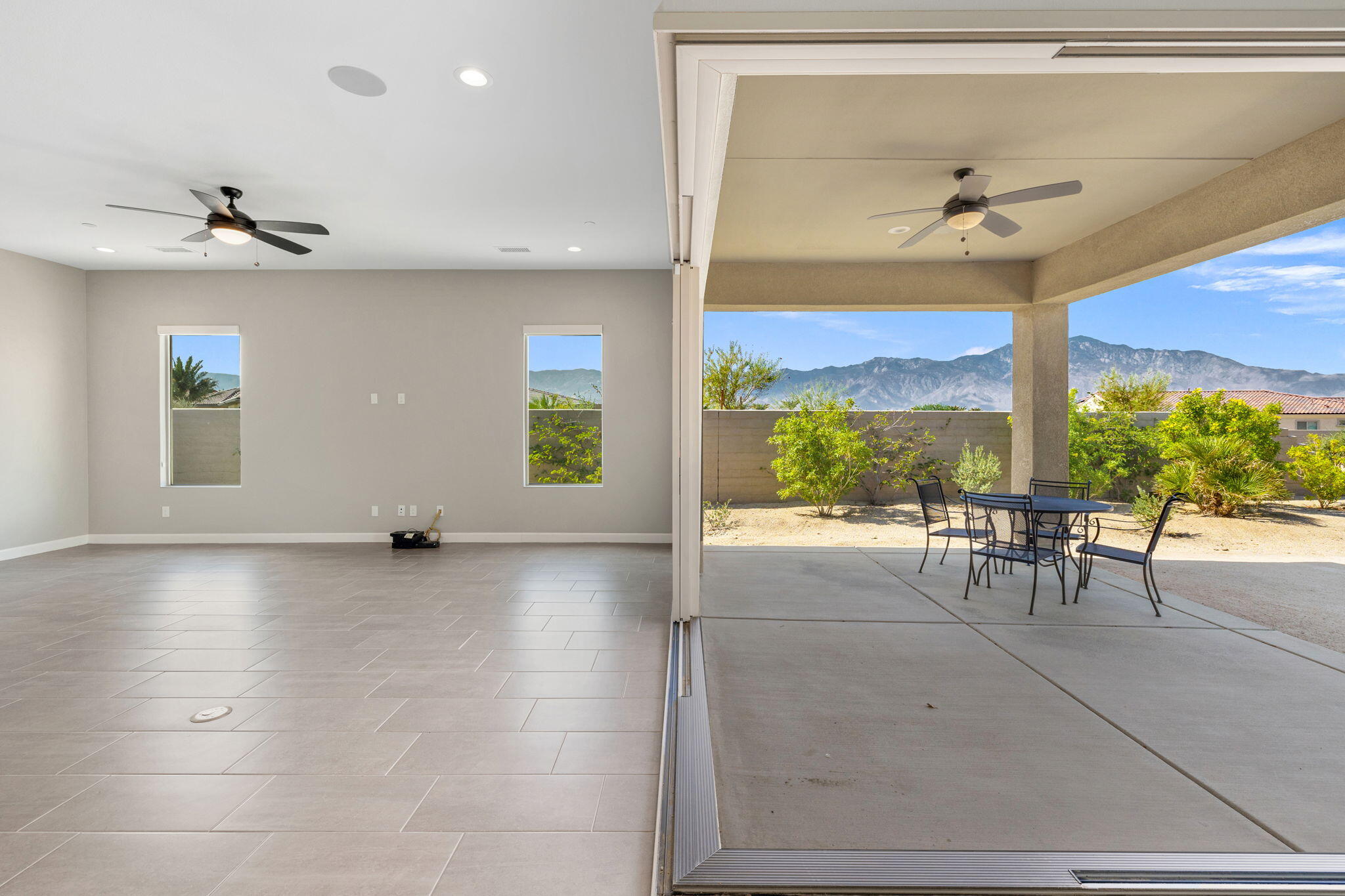 60 Prosecco Rancho Mirage, CA 92270 - Photo 17 of 48 a view of a porch with furniture and a floor to ceiling window