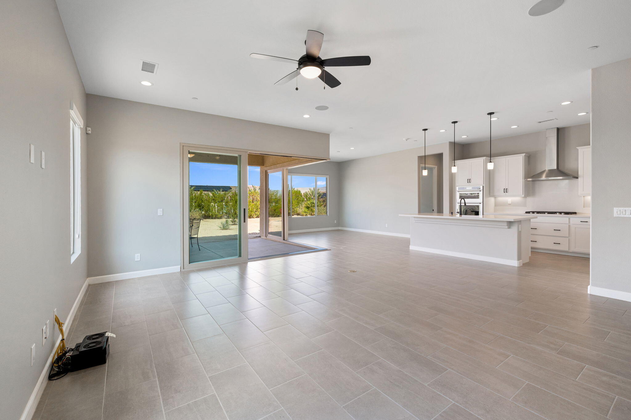 60 Prosecco Rancho Mirage, CA 92270 - Photo 22 of 48 a view of a kitchen with furniture and a floor to ceiling window