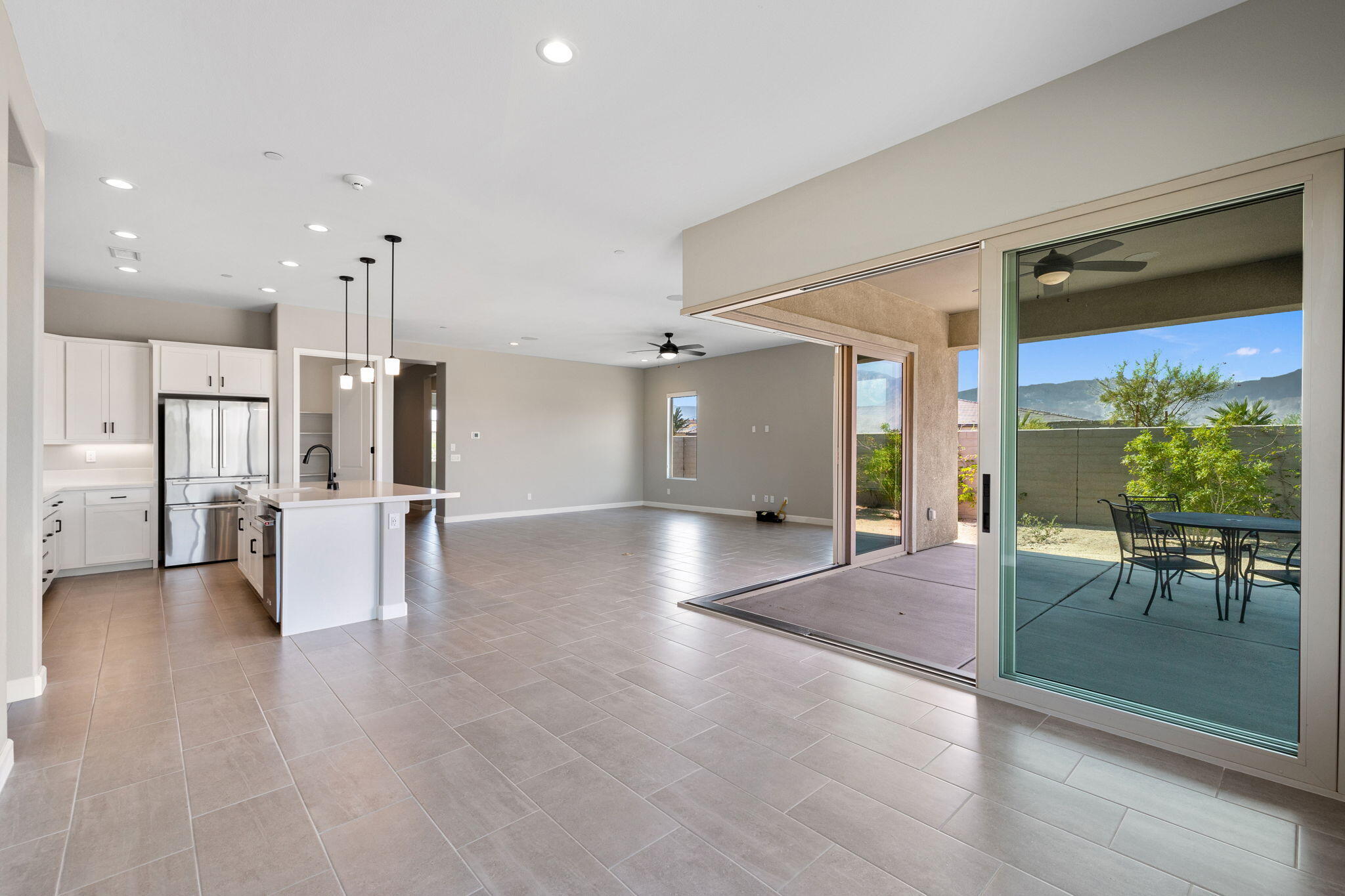 60 Prosecco Rancho Mirage, CA 92270 - Photo 27 of 48 an empty room with wooden floor and windows