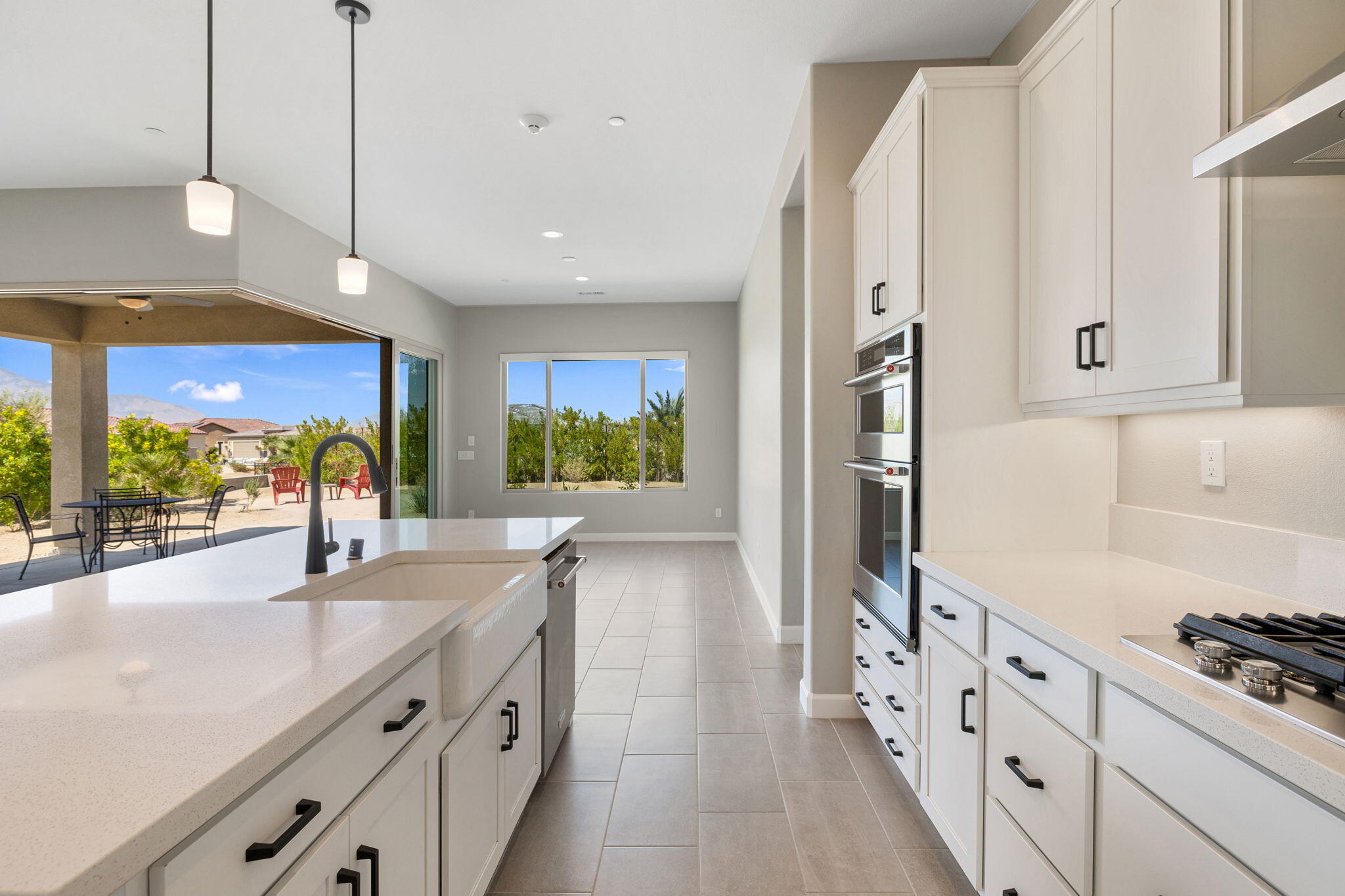 60 Prosecco Rancho Mirage, CA 92270 - Photo 30 of 48 a kitchen with stainless steel appliances granite countertop a lot of counter space and a refrigerator