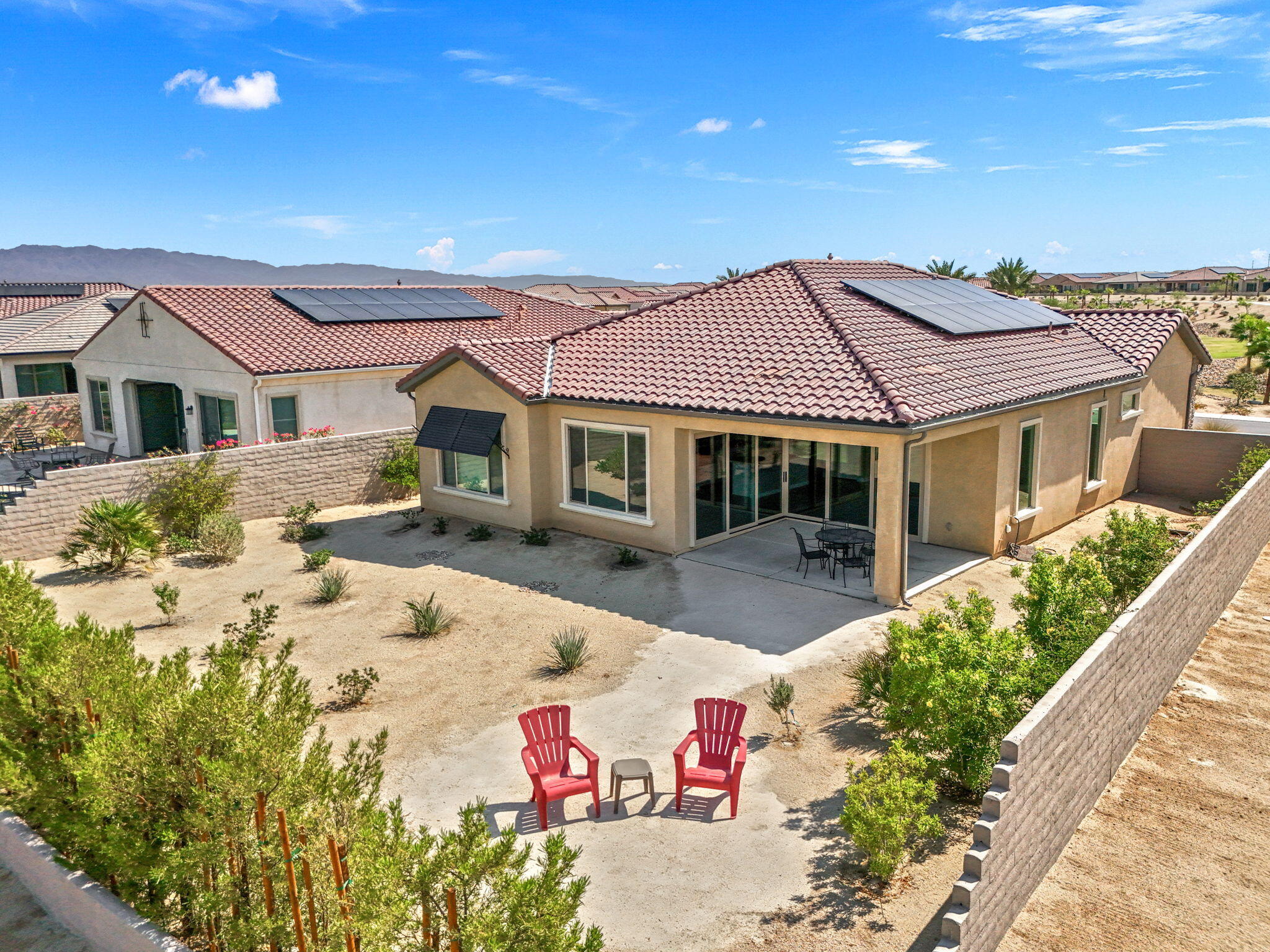 60 Prosecco Rancho Mirage, CA 92270 - Photo 3 of 48 a front view of a house with a yard