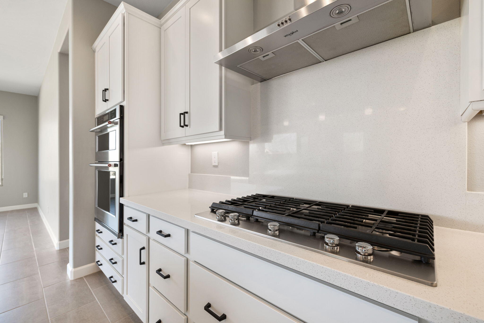 60 Prosecco Rancho Mirage, CA 92270 - Photo 31 of 48 a kitchen with white cabinets and appliances