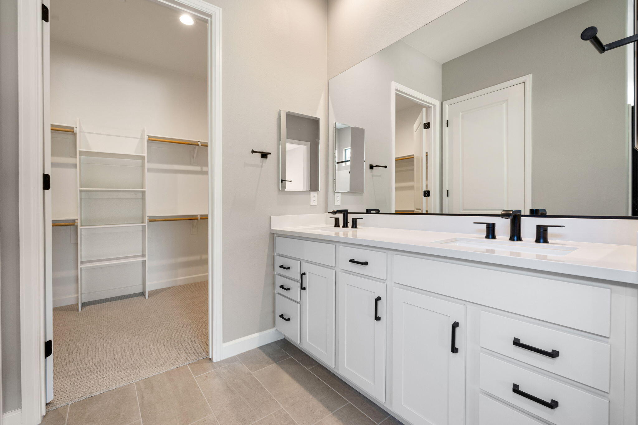 60 Prosecco Rancho Mirage, CA 92270 - Photo 38 of 48 a bathroom with a double vanity sink mirror and double