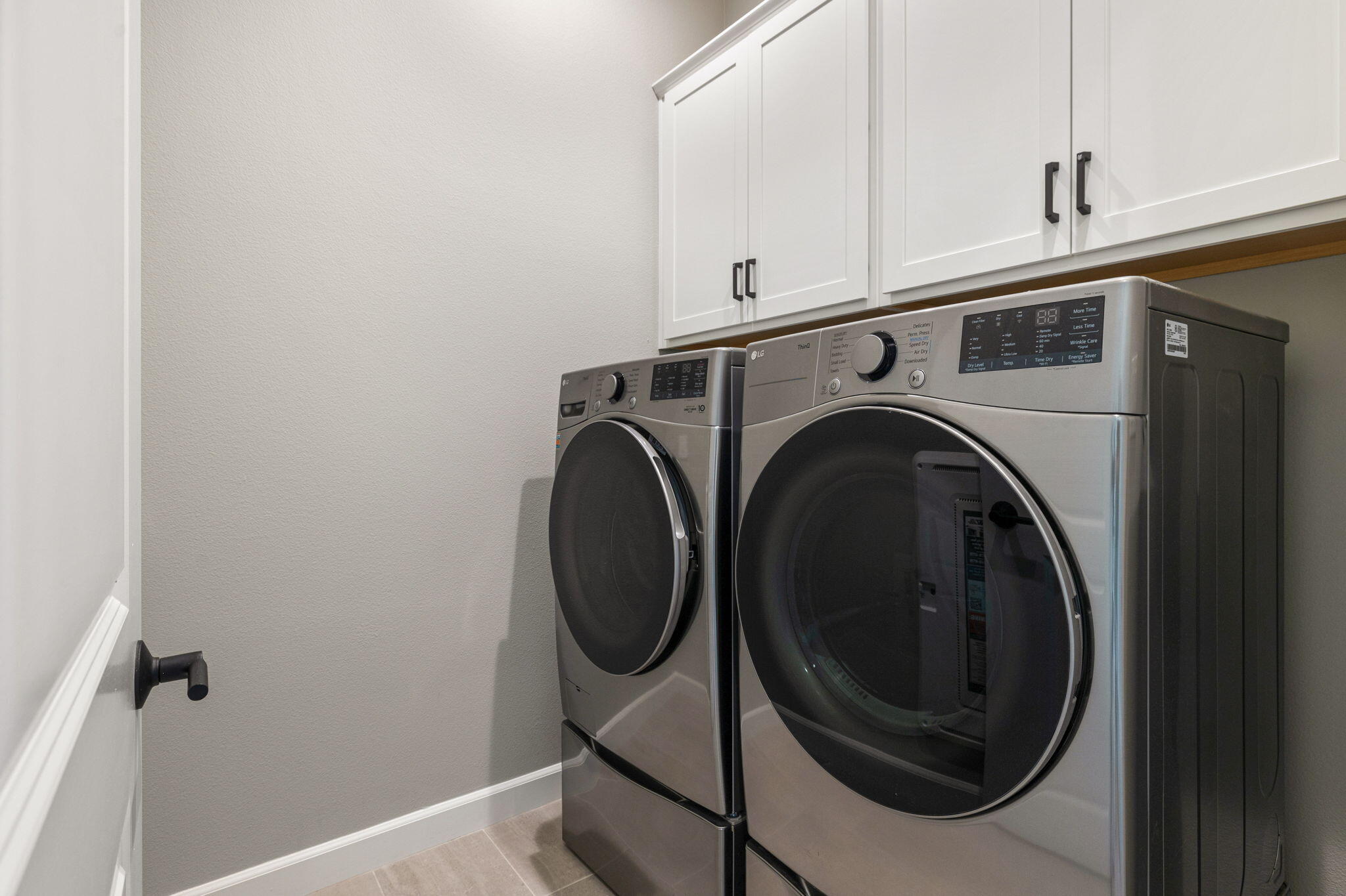 60 Prosecco Rancho Mirage, CA 92270 - Photo 41 of 48 a utility room with dryer and washer
