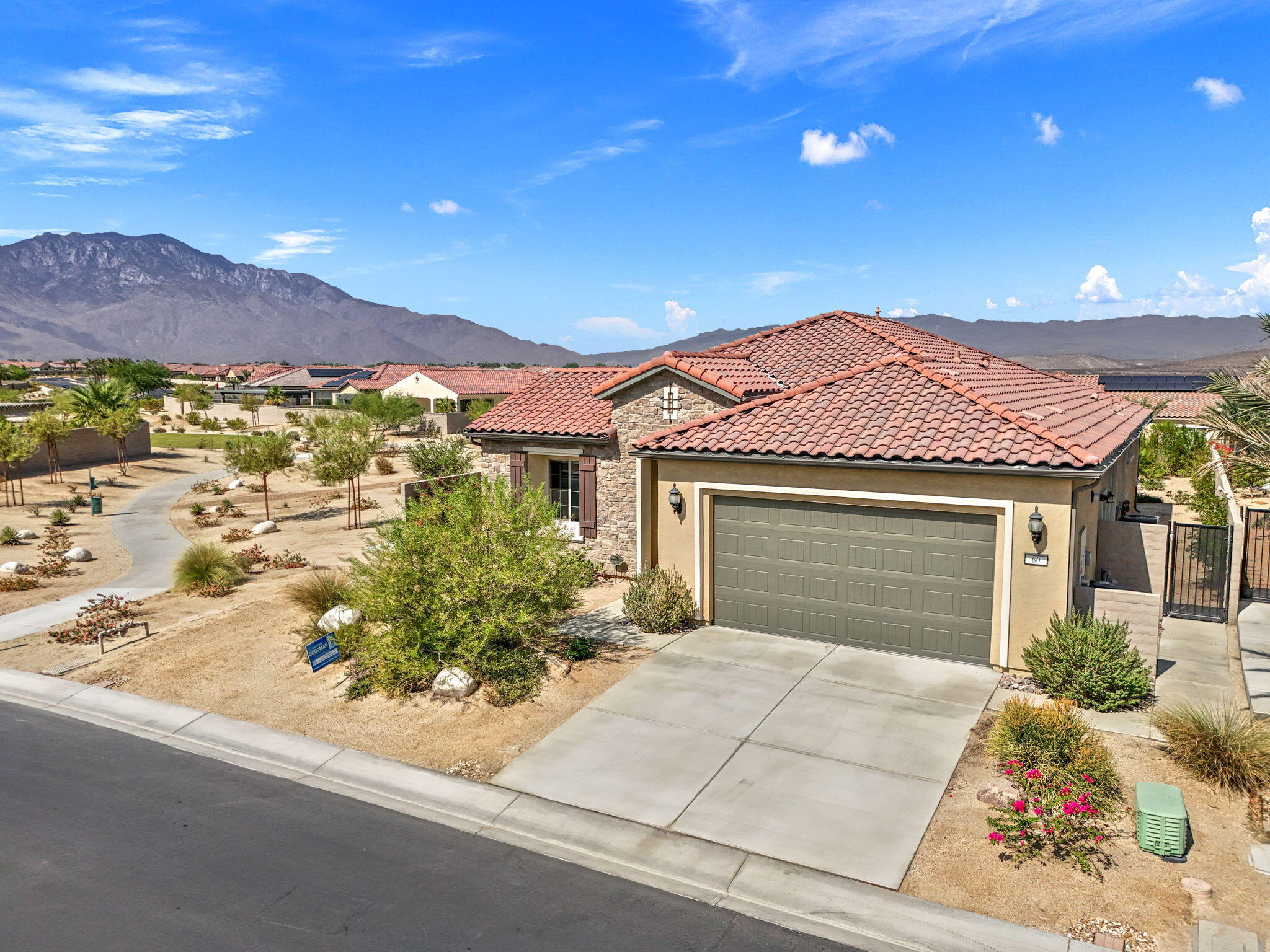 60 Prosecco Rancho Mirage, CA 92270 - Photo 9 of 48 front view of a house with a yard