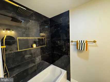 a bathroom with a sink and mirror