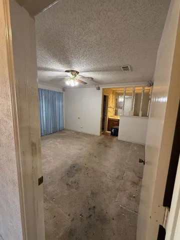 a spacious bathroom with a double vanity sink toilet mirror and bathtub