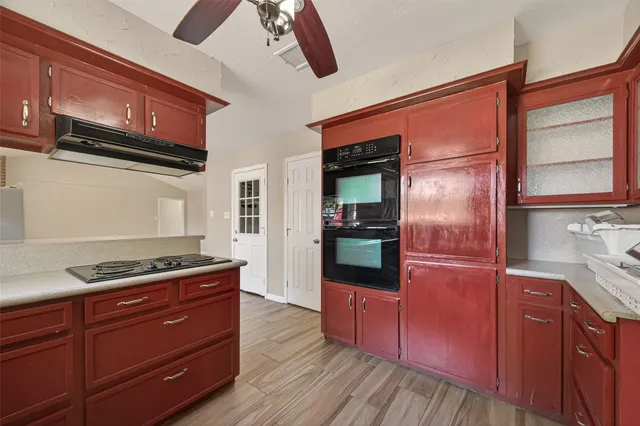 a kitchen with stainless steel appliances granite countertop a stove and a microwave