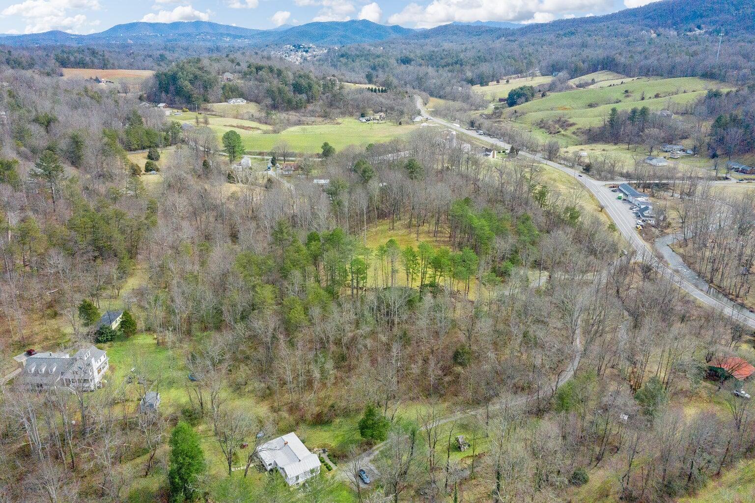 6427 Bent Mountain Road Roanoke, VA 24018 - Photo 8 of 13 a view of a lush green hillside and houses