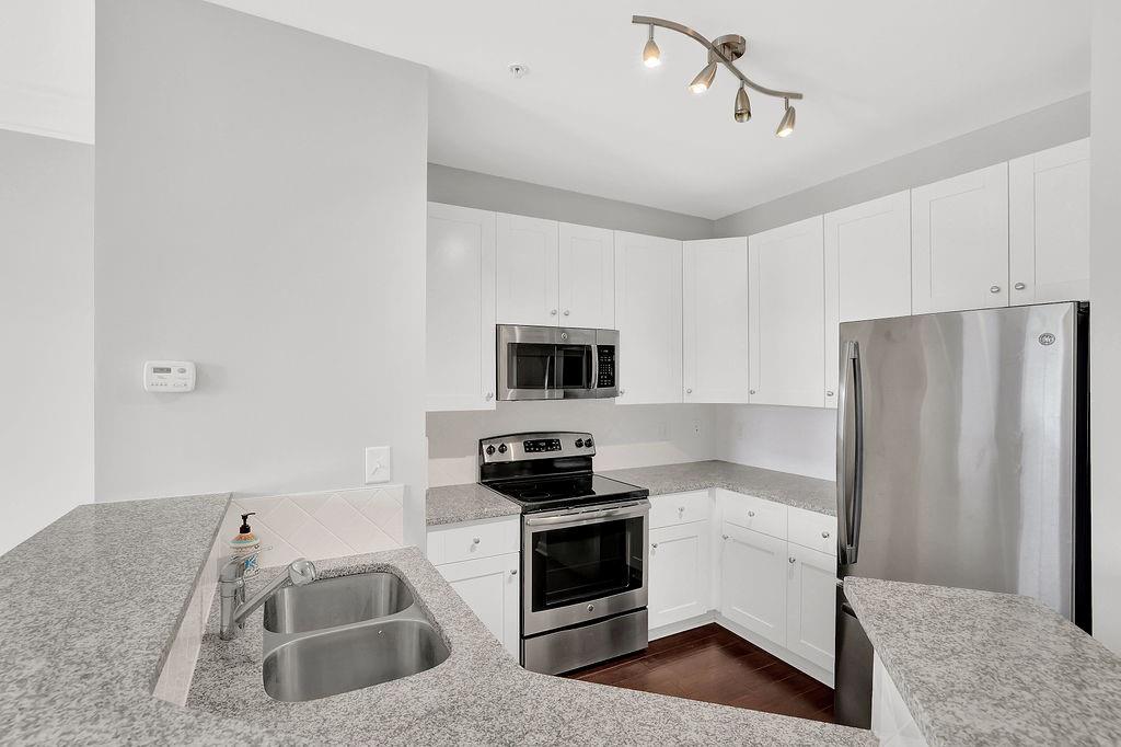 10 Perimeter Summit Boulevard, Unit 4441 Atlanta, GA 30319 - Photo 1 of 1 a kitchen with a refrigerator sink and stove