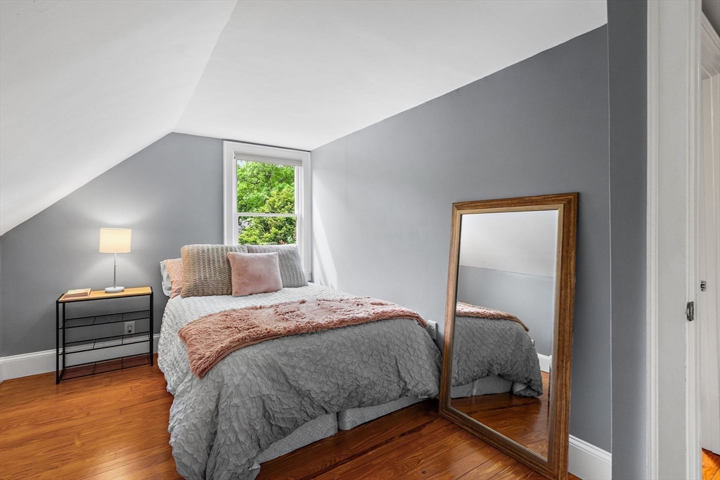 61 Pine Ridge Drive Franklin, MA 02038 - Photo 25 of 41 a bedroom with a bed and a mirror