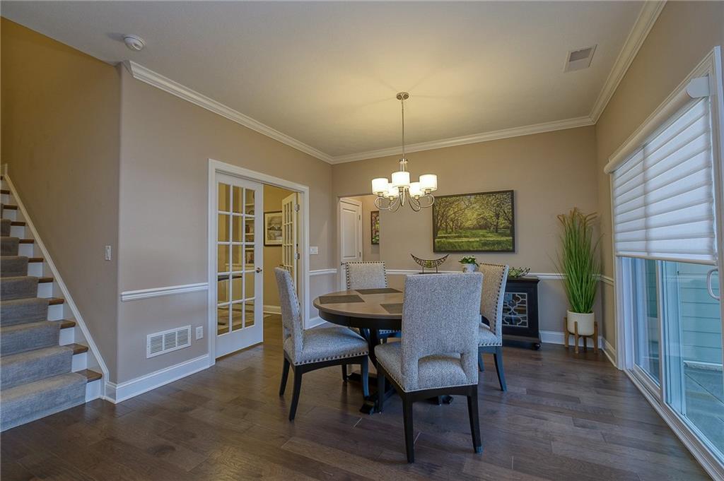 116 Seneca Place Mars, PA 16046 - Photo 11 of 25 a view of a dining room with furniture window and wooden floor