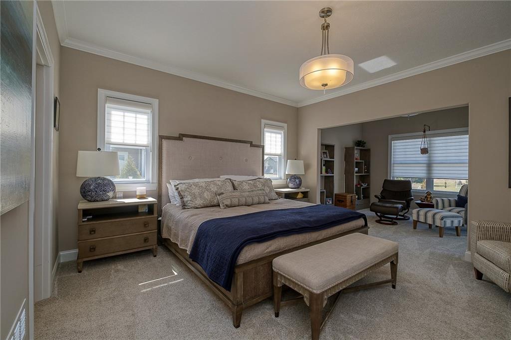 116 Seneca Place Mars, PA 16046 - Photo 13 of 25 a bedroom with bed and a chandelier