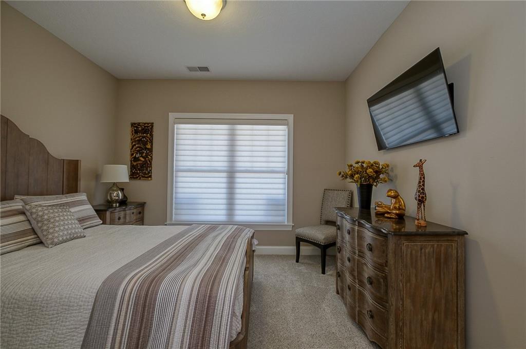 116 Seneca Place Mars, PA 16046 - Photo 16 of 25 a bedroom with a bed and wooden floor