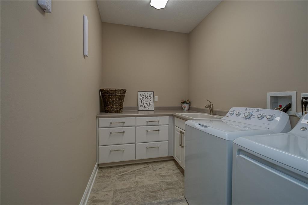 116 Seneca Place Mars, PA 16046 - Photo 23 of 25 a utility room with cabinets washer and dryer