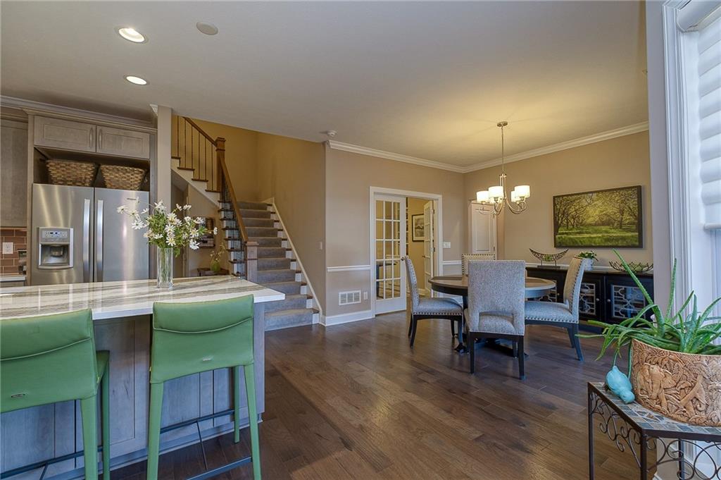 116 Seneca Place Mars, PA 16046 - Photo 9 of 25 a view of a dining room with furniture window and wooden floor