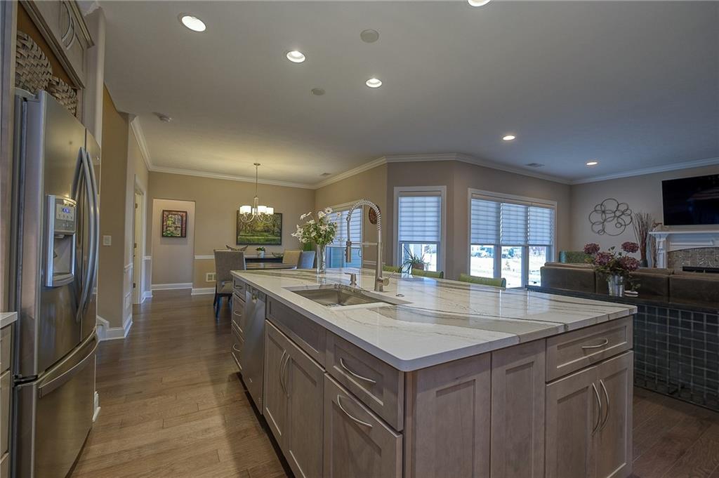 116 Seneca Place Mars, PA 16046 - Photo 10 of 25 a kitchen with center island table and chairs