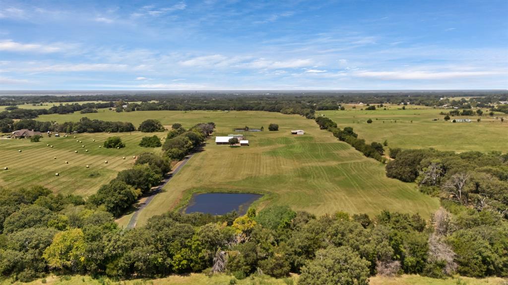 12748 County Road 4077 Scurry, TX 75158 - Photo 16 of 40 an aerial view of residential houses with outdoor space