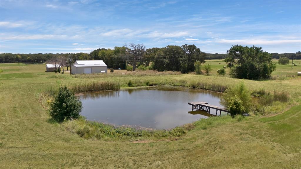 12748 County Road 4077 Scurry, TX 75158 - Photo 18 of 40 a view of a lake with houses in back