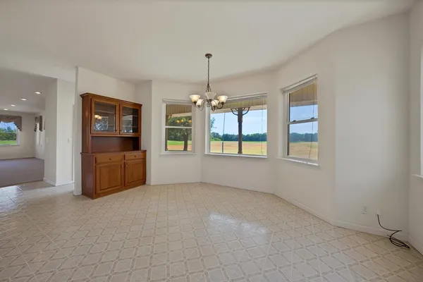 a kitchen with stainless steel appliances a refrigerator and a stove top oven