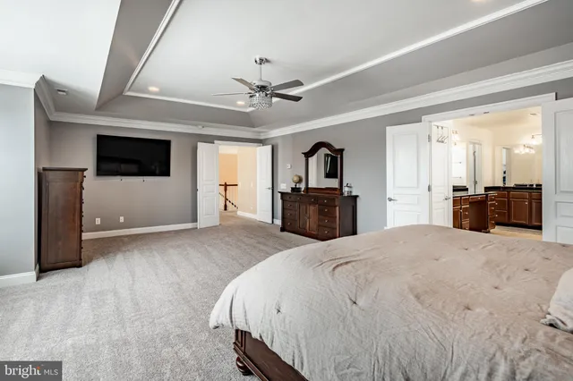 a large bathroom with a tub a sink a mirror and a shower