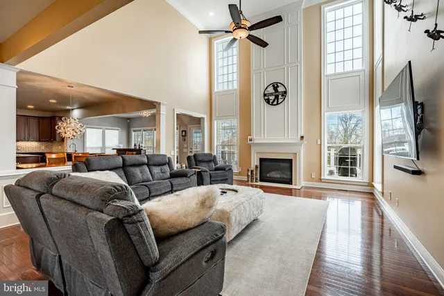 a living room with furniture fireplace and flat screen tv