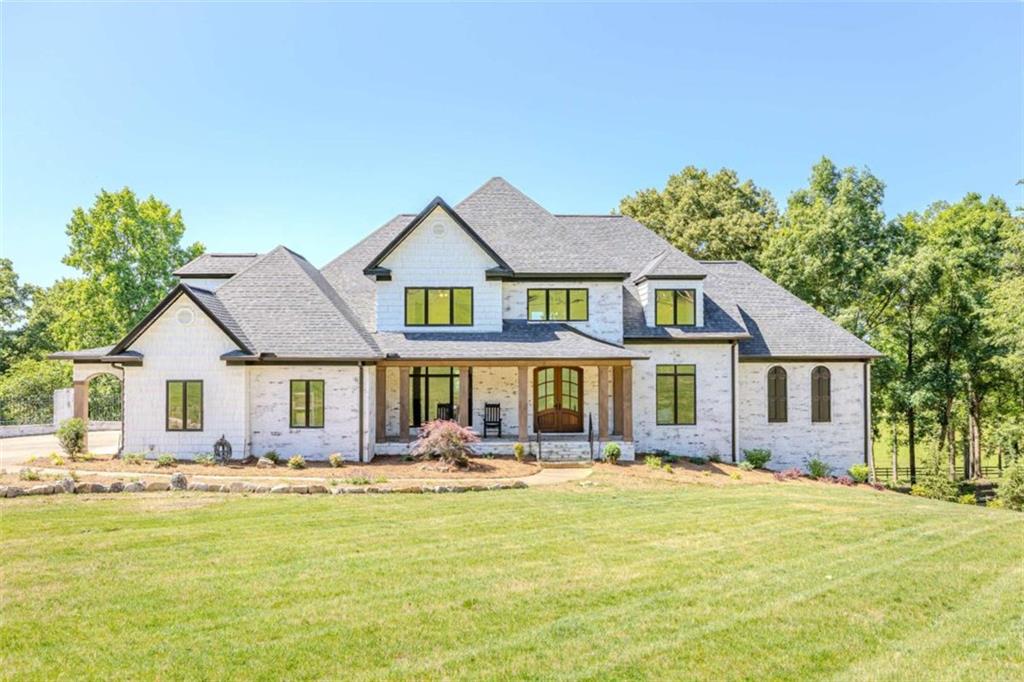 a front view of a house with swimming pool