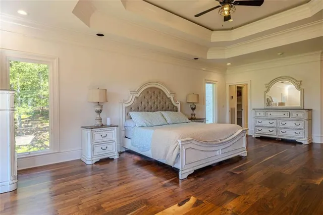 a view of a big room with wooden floor and closet area
