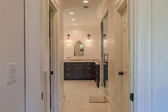 a bathroom with a granite countertop double vanity sink and a mirror