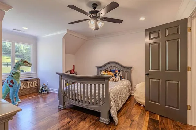 a spacious bedroom with a bed and a couch