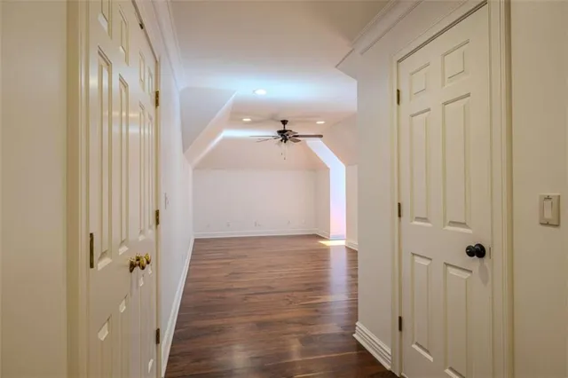 a view of a patio with a dining table and chairs with wooden floor and fence