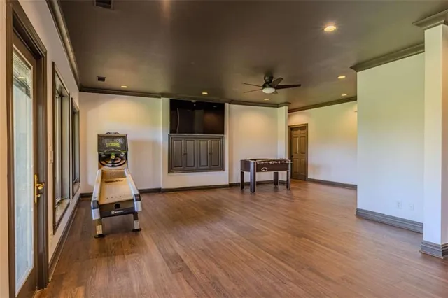 an aerial view of a house with a yard and lake view
