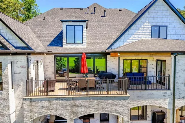a view of a dining room with furniture wooden floor and chandelier