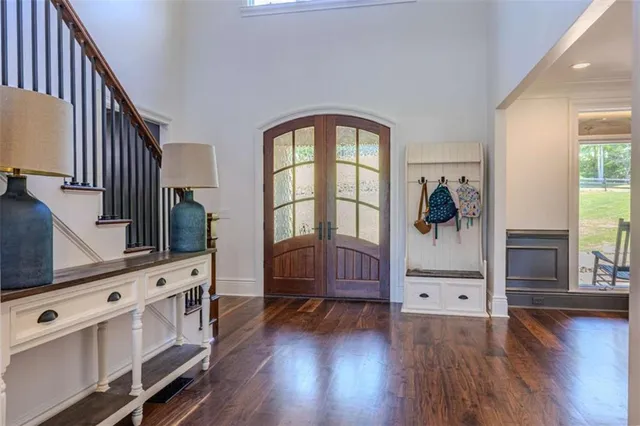 a open kitchen with stainless steel appliances granite countertop a sink a stove and wooden floor