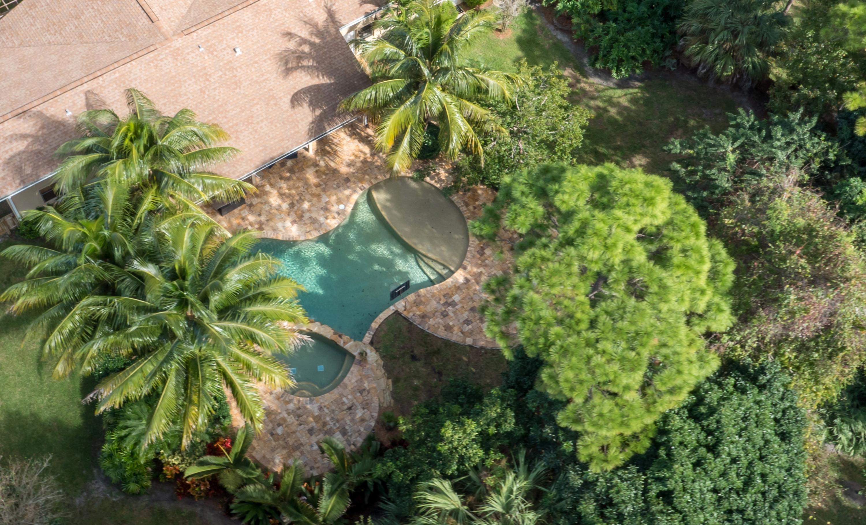 6242 Wood Lake Road Jupiter, FL 33458 - Photo 1 of 27 Private Lush Landscaped Back Yard