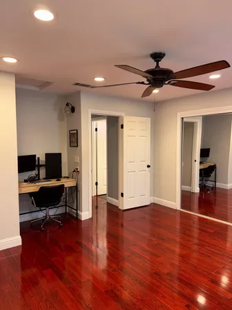 a view of a livingroom with furniture and wooden floor