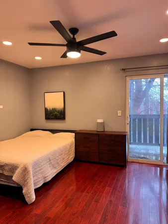 a bed room with a bed and a window