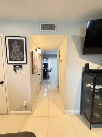 a view of a hallway with a living room