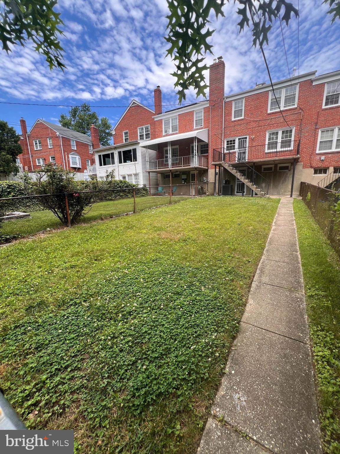 1583 Doxbury Road Towson, MD 21286 - Photo 28 of 31 a front view of a house with a garden and lake view