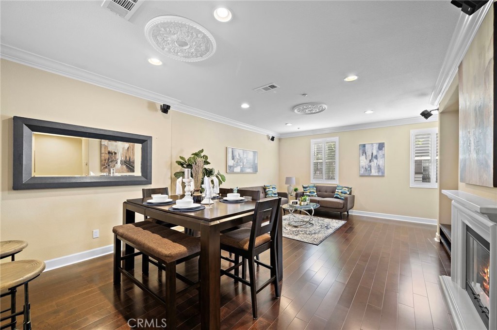 8028 Monaco Stanton, CA 90680 - Photo 8 of 35 dining area opens up to living room