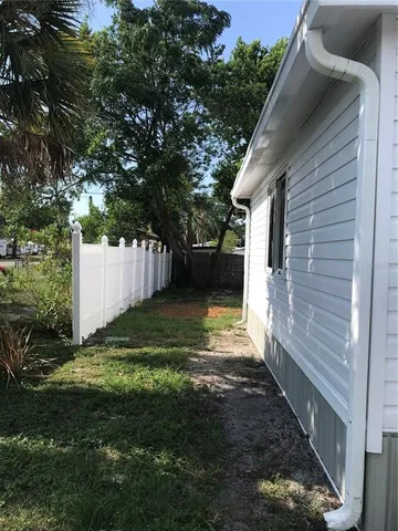 a backyard of a house with lots of green space