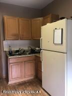 501 North Bromley Avenue Scranton, PA 18504 - Photo 13 of 17 a kitchen with a refrigerator and a stove
