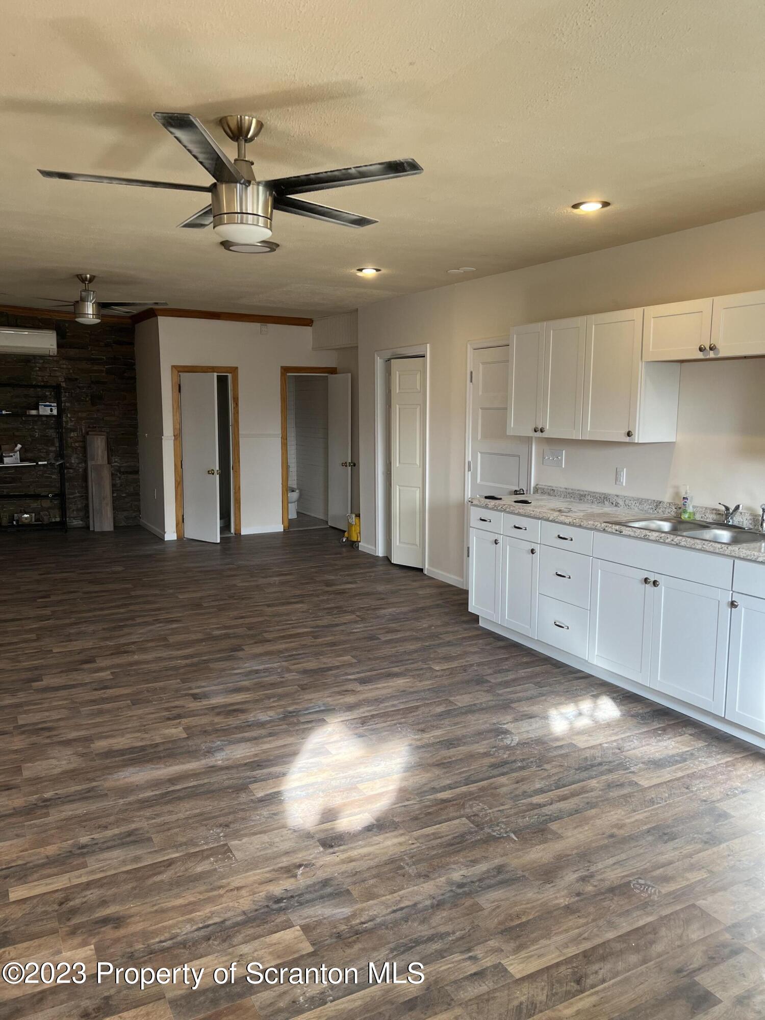 501 North Bromley Avenue Scranton, PA 18504 - Photo 5 of 17 a large kitchen with stainless steel appliances granite countertop a sink and cabinets