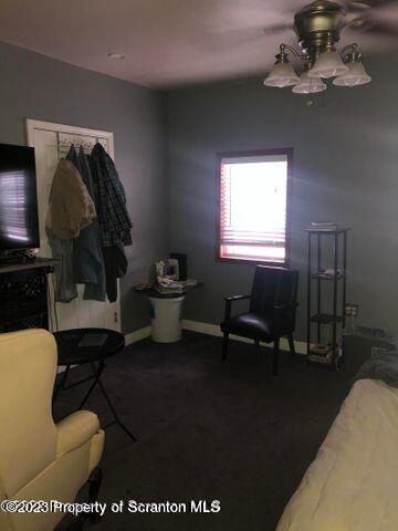 501 North Bromley Avenue Scranton, PA 18504 - Photo 8 of 17 a living room with furniture a rug and a chandelier