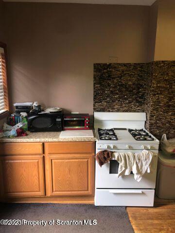 501 North Bromley Avenue Scranton, PA 18504 - Photo 10 of 17 a white stove top oven sitting inside of a kitchen