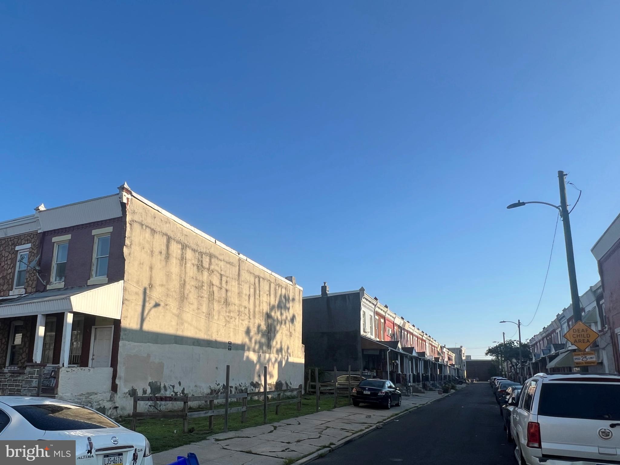 5837 Race Street Philadelphia, PA 19139 - Photo 4 of 5 a city street lined with buildings and cars
